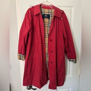 Burberry red raincoat with hood that buttons off and on.
